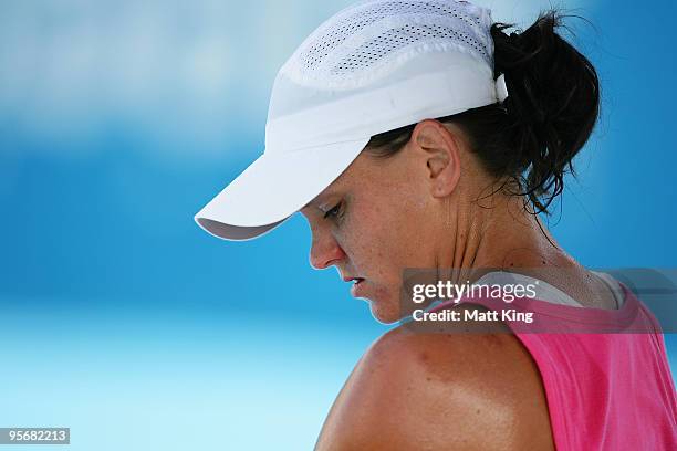 Casey Dellacqua of Australia takes a break in her first round match against Vera Dushevina of Russia during day two of the 2010 Medibank...