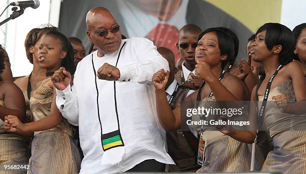 South Africa President Jacob Zuma sings and dances during the African National Congress' 98th anniversary celebrations held at the GWK Park Stadium...