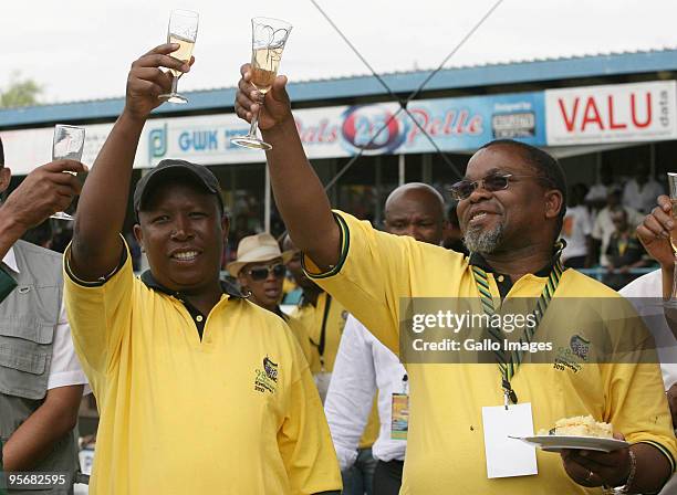 Youth League president Julius Malema and Gwede Mantashe make a toast during the African National Congress' 98th anniversary celebrations held at the...