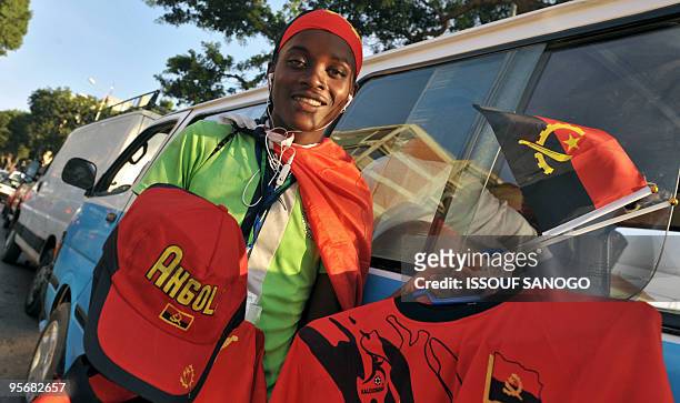 Street vendor sells the Angola's flag and gadgets of Angola national football team on january 7, 2010 in Luanda, three days before the 2010 African...