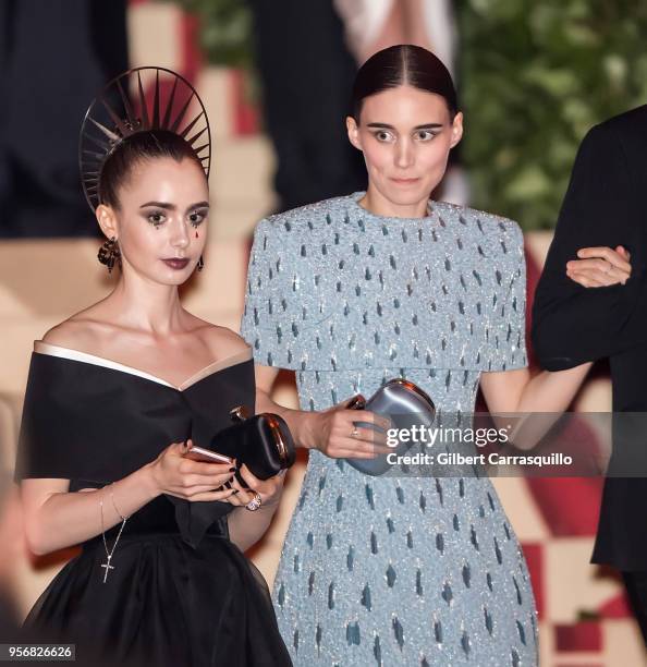 Actors Lily Collins and Rooney Mara are seen leaving the Heavenly Bodies: Fashion & The Catholic Imagination Costume Institute Gala at The...