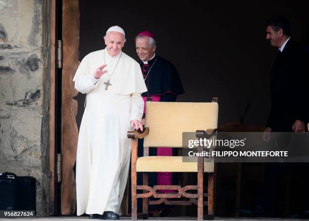 Pope Francis waves to the crowd from the parvis of the Mary Theotokos Shrine during a pastoral visit in Loppiano, on May 10, 2018 near Grosseto,...