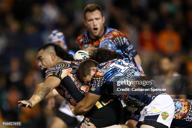 Make Fonua of the Tigers is tackled during the round 10 NRL match between the Wests Tigers and the North Queensland Cowboys at Leichhardt Oval on May...