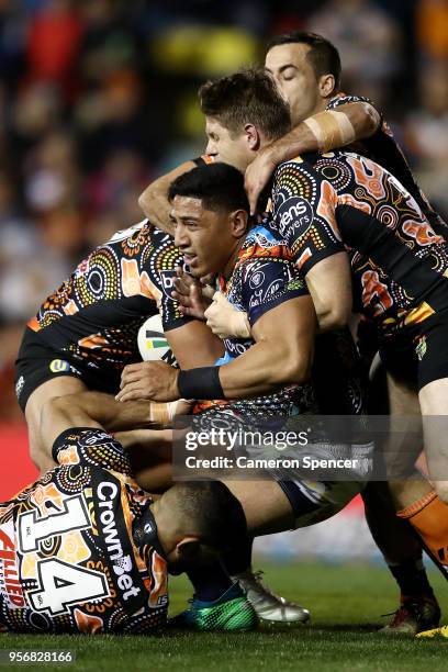 Jason Taumalolo of the Cowboys is tackled during the round 10 NRL match between the Wests Tigers and the North Queensland Cowboys at Leichhardt Oval...