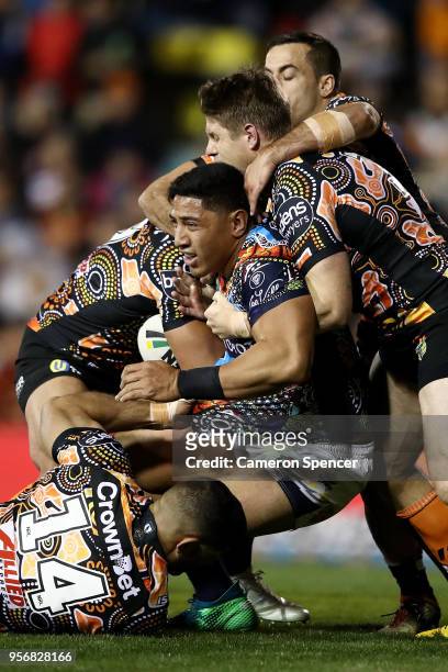 Jason Taumalolo of the Cowboys is tackled during the round 10 NRL match between the Wests Tigers and the North Queensland Cowboys at Leichhardt Oval...