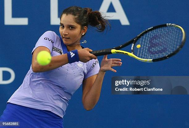 Sania Mirza of India plays a forehand in her first round match against Alicia Molik of Australia during day four of the Moorilla Hobart International...