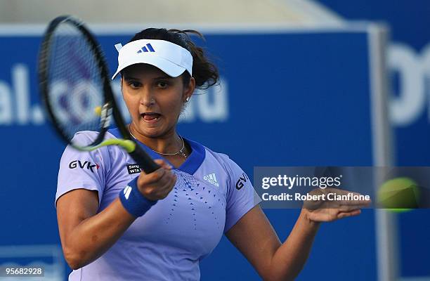 Sania Mirza of India plays a forehand in her first round match against Alicia Molik of Australia during day four of the Moorilla Hobart International...