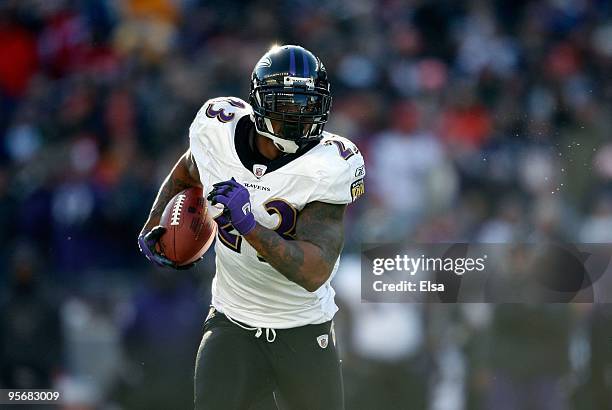 Willis McGahee of the Baltimore Ravens runs the ball against the New England Patriots during the 2010 AFC wild-card playoff game at Gillette Stadium...