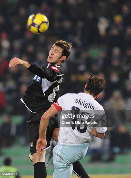 Antonio Floro Flores of Udinese competes with Sebastiano Siviglia of Lazio during the Serie A match between Udinese and Lazio at Stadio Friuli on...