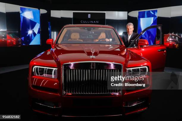 Torsten Mueller-Oetvoes, chief executive officer of Rolls-Royce Motor Cars Ltd., poses with the Rolls-Royce Cullinan sport utility vehicle at its...