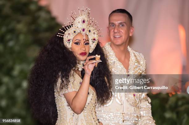 Rapper Cardi B and fashion designer Jeremy Scott are seen leaving the Heavenly Bodies: Fashion & The Catholic Imagination Costume Institute Gala at...