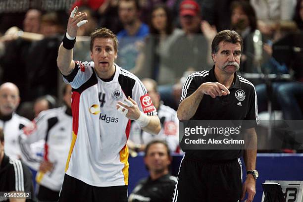 Head coach Heiner Brand and Oliver Roggisch of Germany react during the international handball friendly match between Germany and Iceland at the...