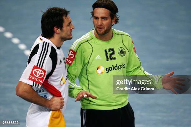 Goalkeeper Silvio Heinevetter of Germany discusses with team mate Michael Mueller during the international handball friendly match between Germany...