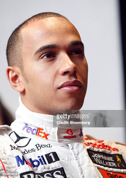 Lewis Hamilton, formula 1 driver for McLaren Racing Ltd, listens during the press conference to unveil the new Banco Santander SA branding for Abbey...