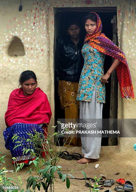 Nepal-rights-prostitution,FEATURE by Claire Cozens This photo taken on December 16, 2009 shows Nepalese woman Durpati Nepali and her daughter Binita...