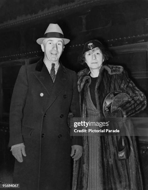 American film producer Harry Warner , President of Warner Bros. Pictures, Inc, and his wife Rea arrive in New York on the 20th Century Limited train,...