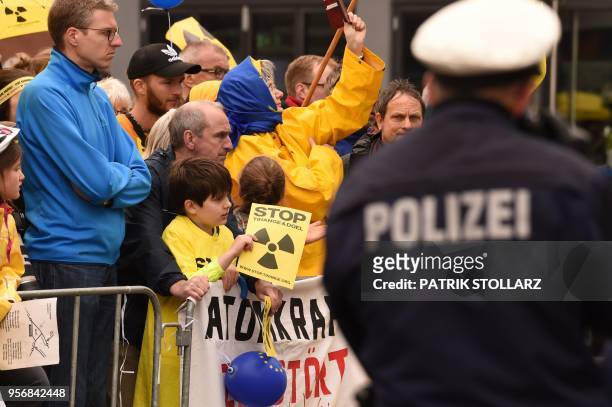 Child holds a placard against Belgium's Tihange 2 and the Netherland's Doel 3 nuclear power plants during an anti-nuclear protester outside the city...