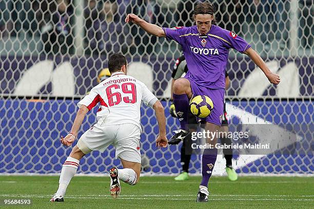 Per Kroldup of ACF Fiorentina in action against Riccardo Meggiorini of AS Bari during the Serie A match between Fiorentina and Bari at Stadio Artemio...