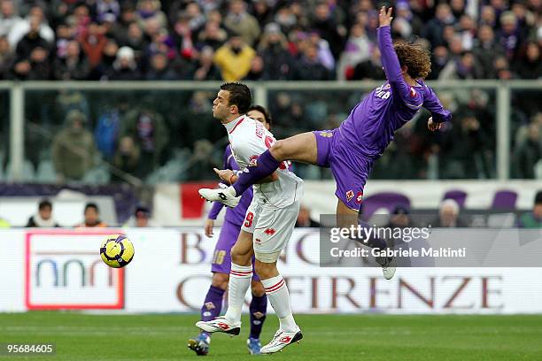 Marco Donadel of ACF Fiorentina in action against Riccardo Meggiorini of AS Bari during the Serie A match between Fiorentina and Bari at Stadio...