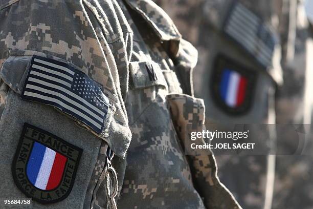 Soldiers of the PRT receive their French insignia patches following their integration in the French "Task force La Fayette" at Forward Operating Base...