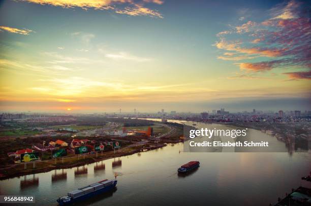 view over mekong river and saigon / ho-chi-minh-city in the early morning - river mekong stock pictures, royalty-free photos & images