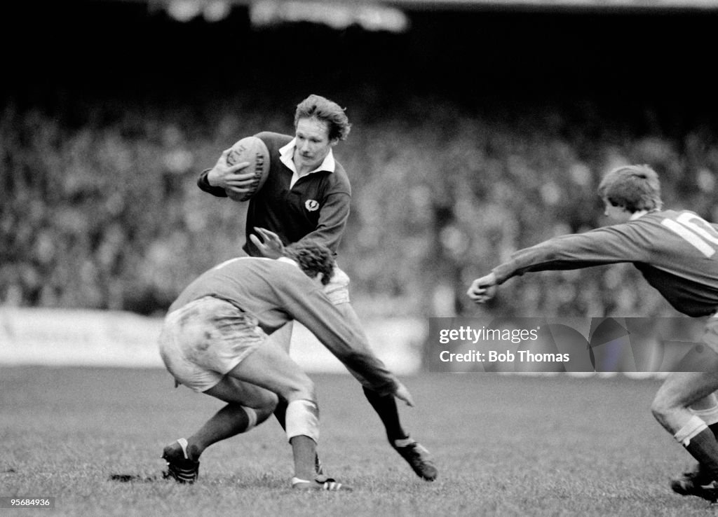 John Rutherford of Scotland is tackled by David Pickering of Wales ...