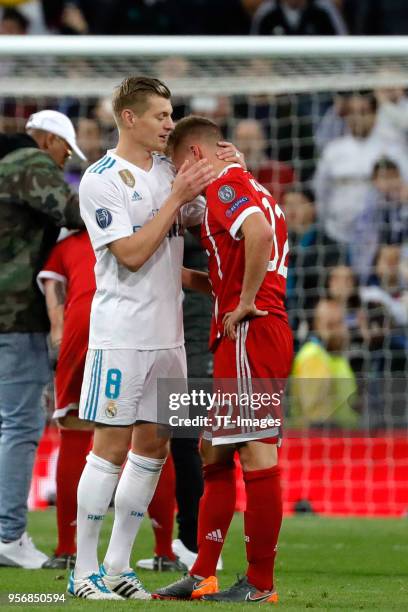 Toni Kroos of Real Madrid speaks with Joshua Kimmich of Muenchen during the UEFA Champions League Semi Final Second Leg match between Real Madrid and...