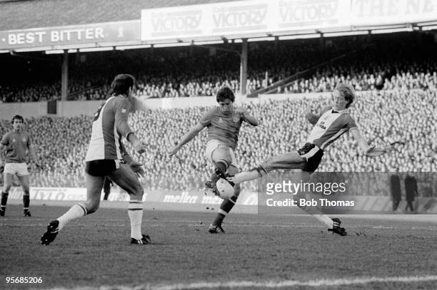 Steve Aizlewood of Portsmouth has his shot blocked by Mark Wright of Southampton during the Portsmouth v Southampton FA Cup 4th Round match played at...