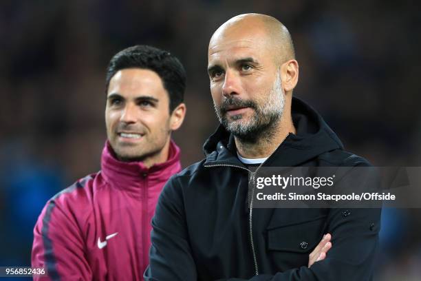 Man City manager Pep Guardiola stands alongside assistant Mikel Arteta during the Premier League match between Manchester City and Brighton & Hove...