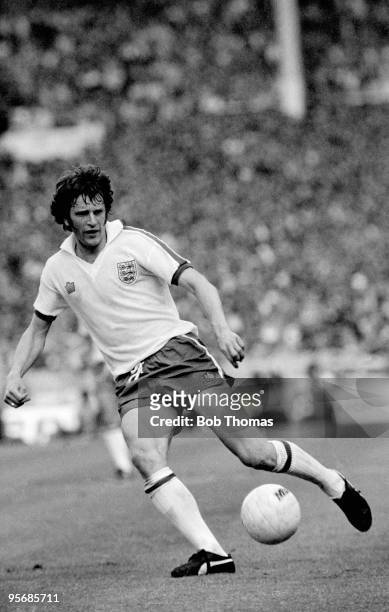 Mike Channon in action for England against Scotland during their British Home Championship match at Wembley Stadium in London, 4th June 1977....