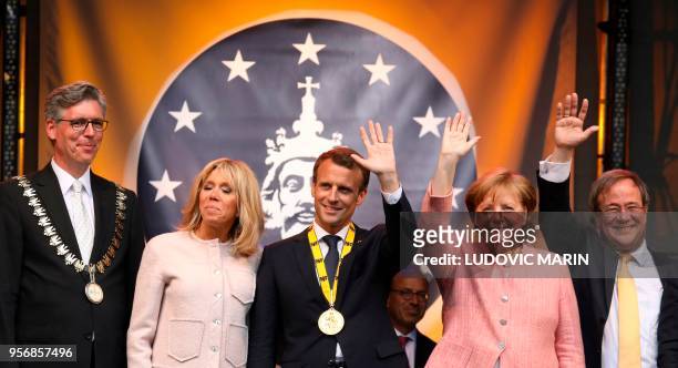 France's President Emmanuel Macron , his wife Brigitte Macron , Germany's Chancellor Angela Merkel Aachens Mayor Marcel Philipp and North...