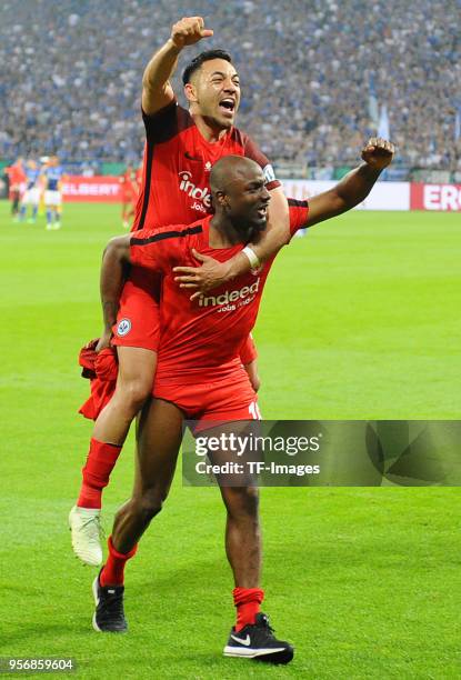 Marco Fabian of Frankfurt and Jetro Willems of Frankfurt celebrate after winning the DFB Cup semi final match between FC Schalke 04 and Eintracht...