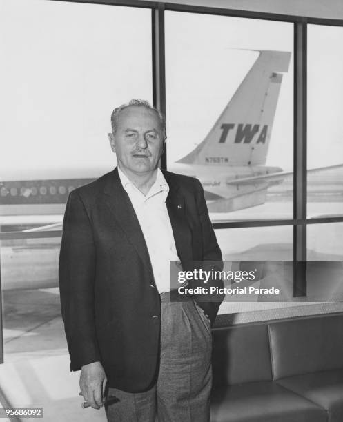 American film producer and screenwriter Darryl F. Zanuck at JFK airport, New York, before a flight to Paris, where he will complete his work on 'The...