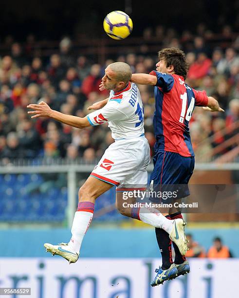 Giusseppe Sculli of Genoa CFC goes up for the ball against Giuseppe Bellusci of Catania Calcio during the Serie A match between Genoa CFC and Catania...