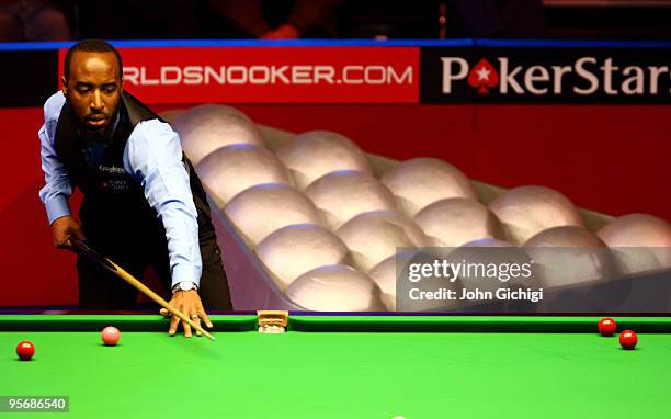 Rory McLeod lines up his shot in his match against Mark Williams of England during the PokerStar.com Masters snooker tournament at Wembley Arena on...