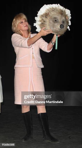 Joanna Lumley in a costume from Tales of Beatrix Potter attends a photocall for Tickets For Troops at the Royal Opera House on January 11, 2010 in...