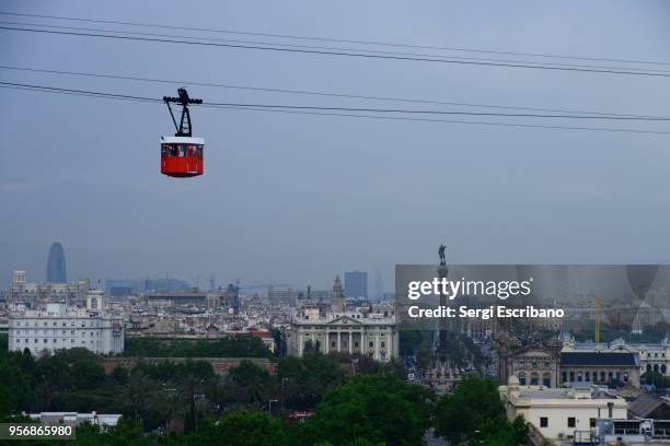 aerial view of barcelona with the cable car in the background - aerial cable stock-fotos und bilder