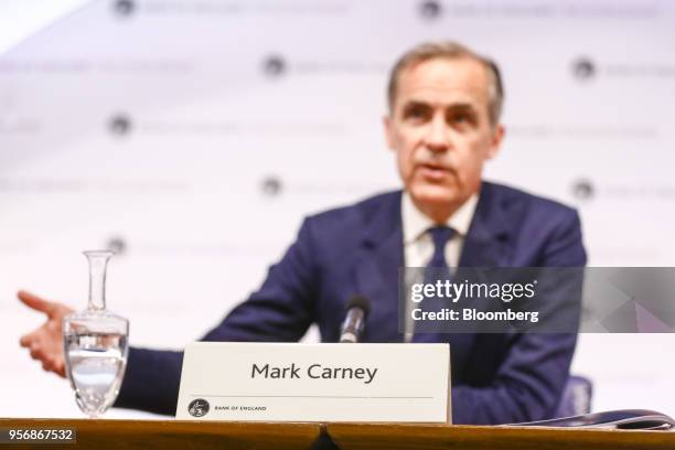 Name plaque for Mark Carney, governor of the Bank of England , sits on a desk as he speaks during the bank's quarterly inflation report news...