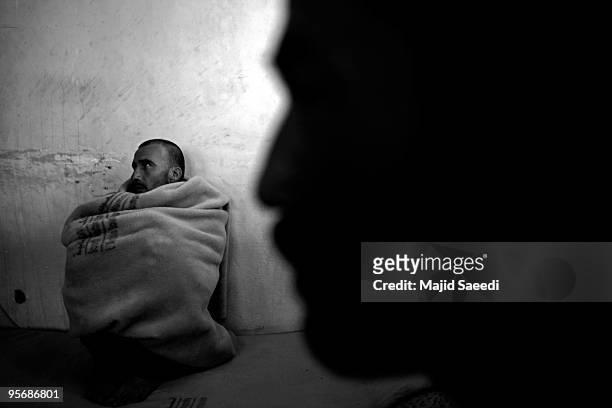 Drug addict sits while attending the Wadan detox program at the Kabul Drug Treatment and Rehabilitation Center on January 03, 2010 in Kabul,...