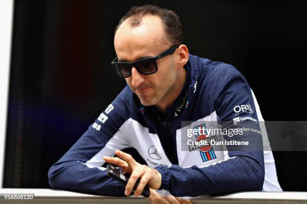 Robert Kubica of Poland and Williams looks on in the Pitlane during previews ahead of the Spanish Formula One Grand Prix at Circuit de Catalunya on...