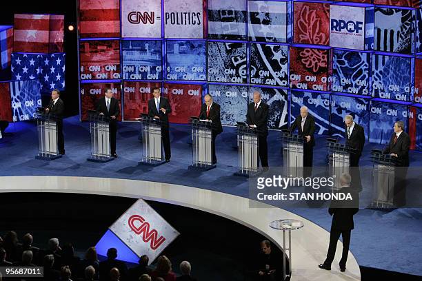 Republican presidential hopefuls take questions from CNN moderator Anderson Cooper during the CNN/YouTube Republican presidential debate 28 November...