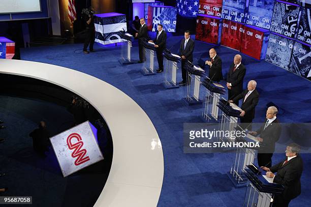 Republican presidential hopefuls stand at their respective podiums during the CNN/YouTube Republican presidential debate 28 November 2007 in St....