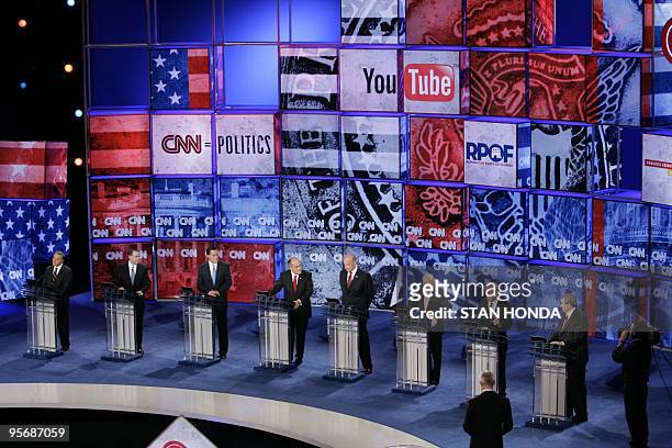 Republican presidential hopefuls stand at their respective podiums during the CNN/YouTube Republican presidential debate 28 November 2007 in St....