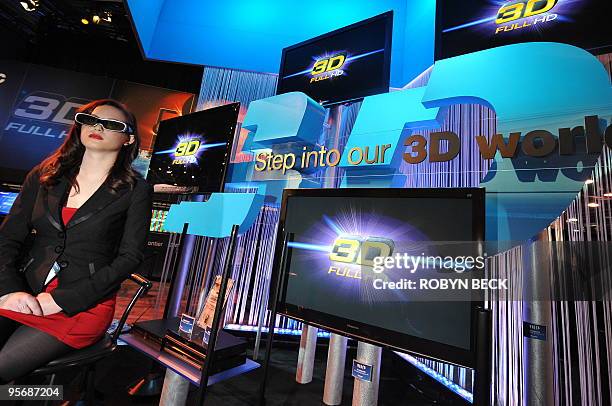 Model wears 3D glasses at a 3D display at the Panasonic booth at the 2010 International Consumer Electronics Show, January 8, 2010 in Las Vegas,...