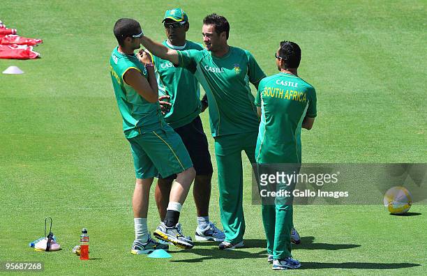 Vincent Barnes of South Africa looks on as Mark Boucher jokes around with Wayne Parnell during a training session at the Bidvest Wanderers Stadium on...
