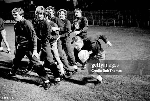 Liverpool and England mid-fielder Sammy Lee in action during a team relay exercise watched by Graham Roberts, Russell Osman, Kenny Sansom, Peter...