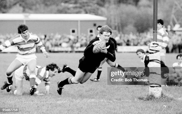 As part of the New Zealand All Black's Rugby Union Tour of Great Britain, New Zealand captain Stu Wilson dives over to score his second try after...