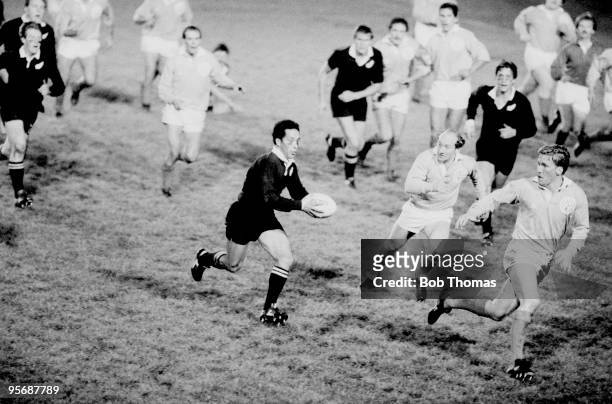 As part of the New Zealand All Black's Rugby Union Tour of Great Britain, New Zealand's Steve Pokere sets up a New Zealand attack watched by the...