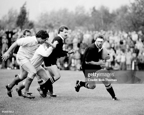 As part of the New Zealand All Blacks Rugby Union Tour of Great Britain, New Zealand's Geoff Old is pictured in possession as Edinburgh's Jim Calder...