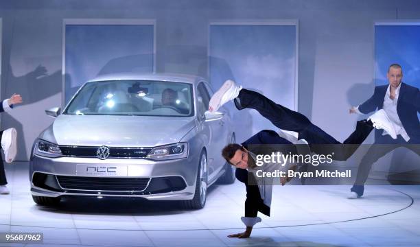 Dancers perform during the introduction of the Volkswagen NCC Hybrid Concept during the press preview for the world automotive press at the North...